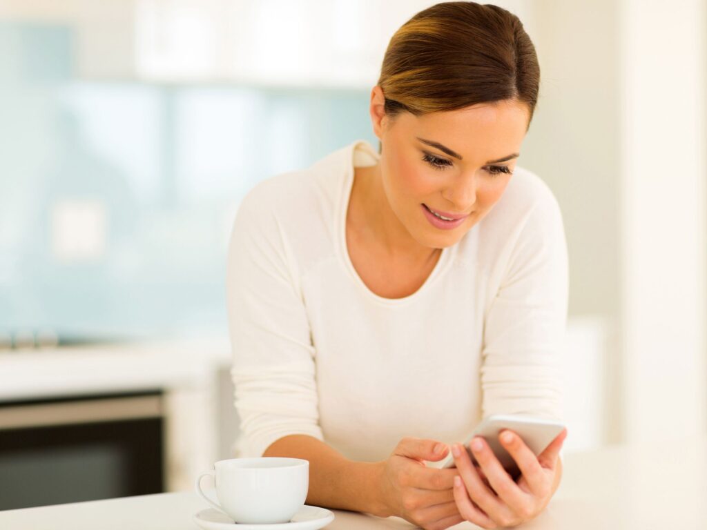 woman checking email on phone